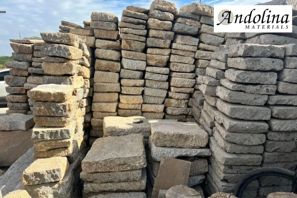 Landscaping stone supply yard with stacked natural rocks